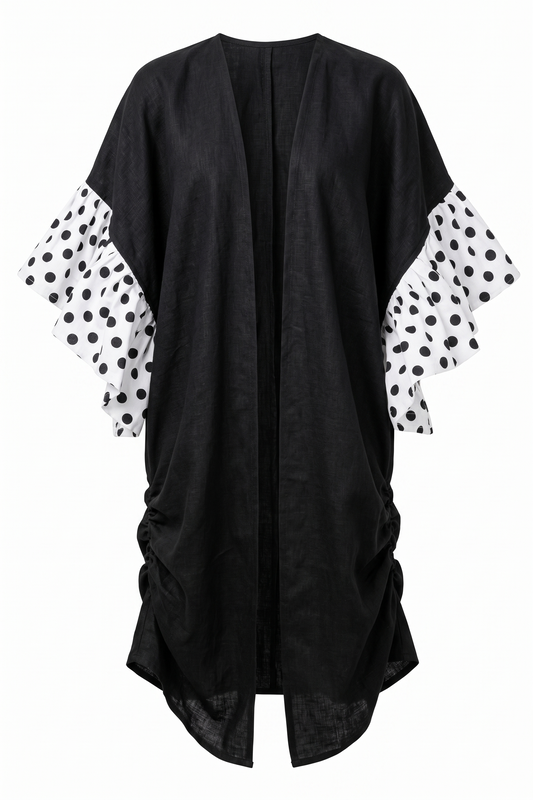 Black linen kimono with pleated polka dot sleeves on a white background by Mesan.