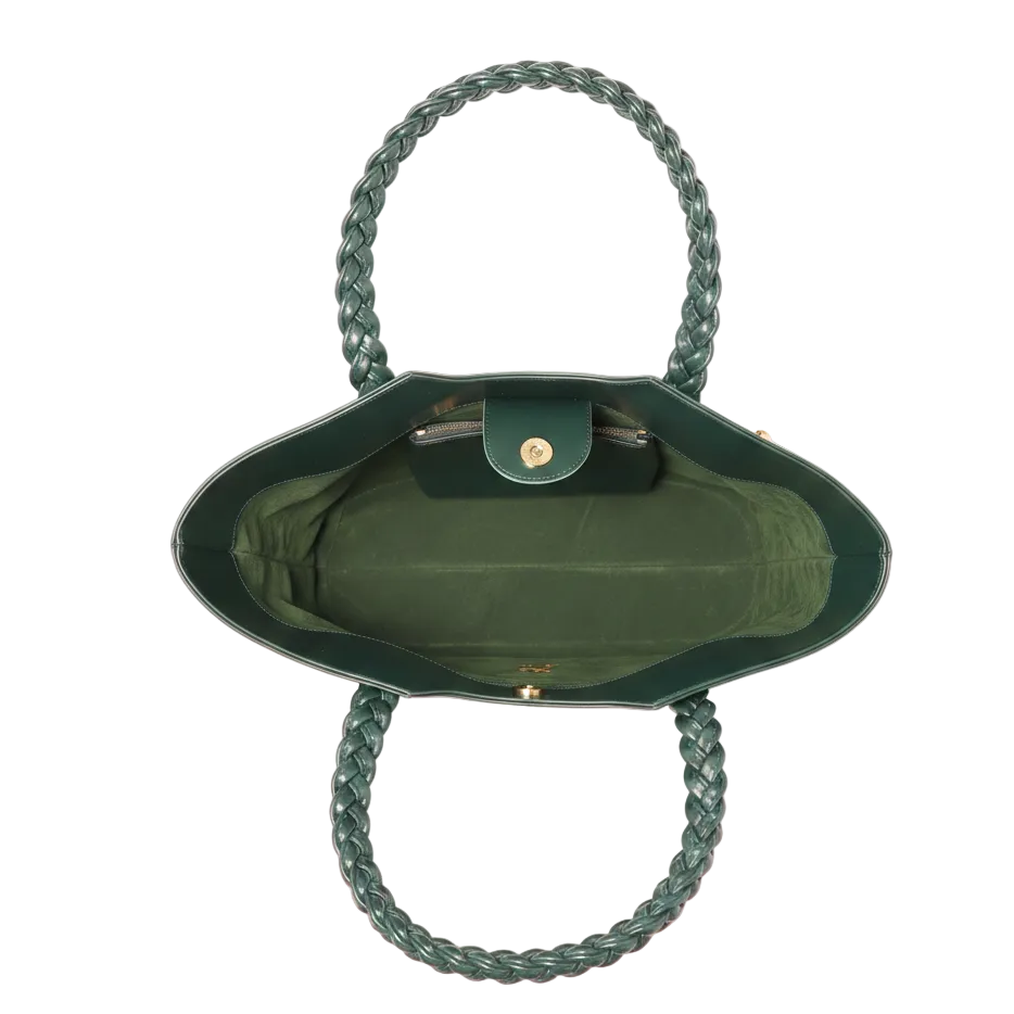 Green handbag with braided handles on a white background
